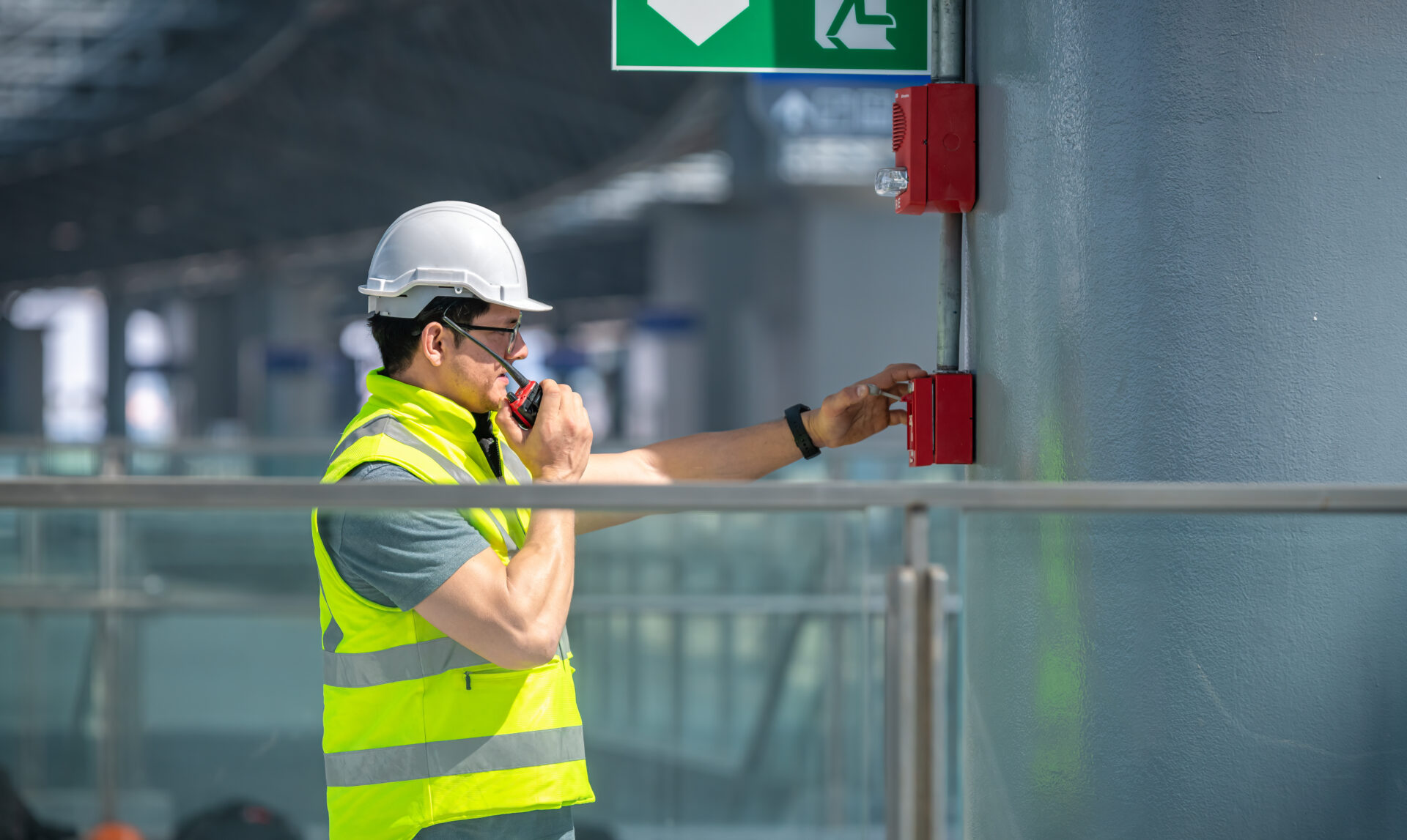 Engineer wearing safety unifrom and helmet under checking fire safety